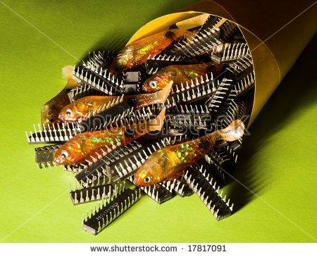 -chips-rubber-or-plastic-fishing-lures-and-computer-chips-in-a-yellow-paper-cone-with-a-17817091.jpg