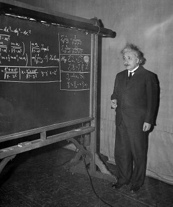 einstein-at-blackboard-chalk-in-hand.jpg