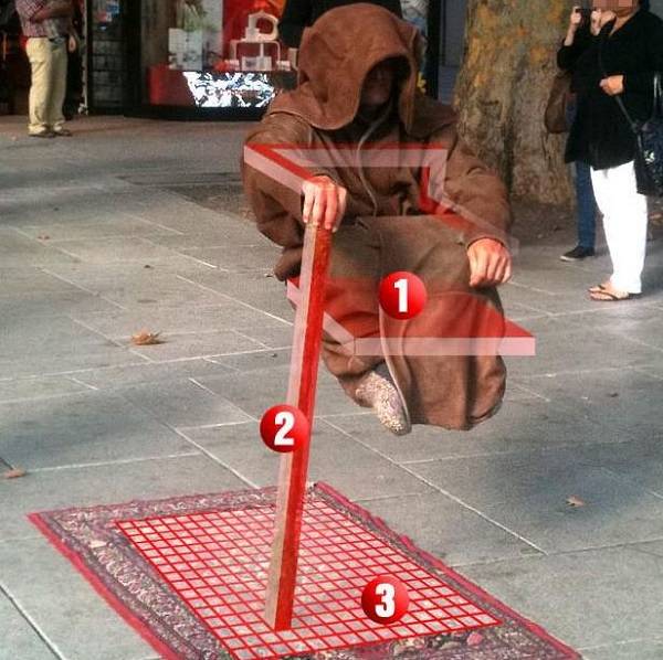 levitating-street-performer-magic-trick-revealed.jpg