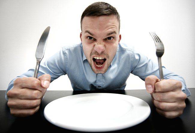 man-hungry-angery-plate-utensils-eating-diet-nutrition.jpg