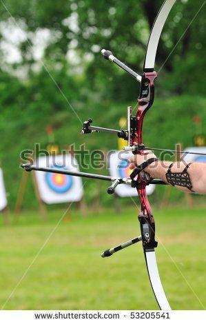 -photo-archer-pulls-on-the-sport-bow-string-taking-aim-at-his-target-at-the-competition-53205541.jpg