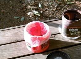 repurposed.ground.coffee.container.as.a.waste.recepticle.jpg