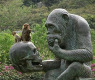 monkeys-chimp-statue-human-skull-thinking.jpg